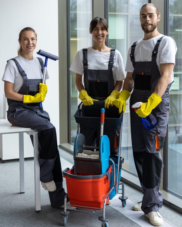 Housekeeping team. Group of young people from housekeeping staff looking confident and contented